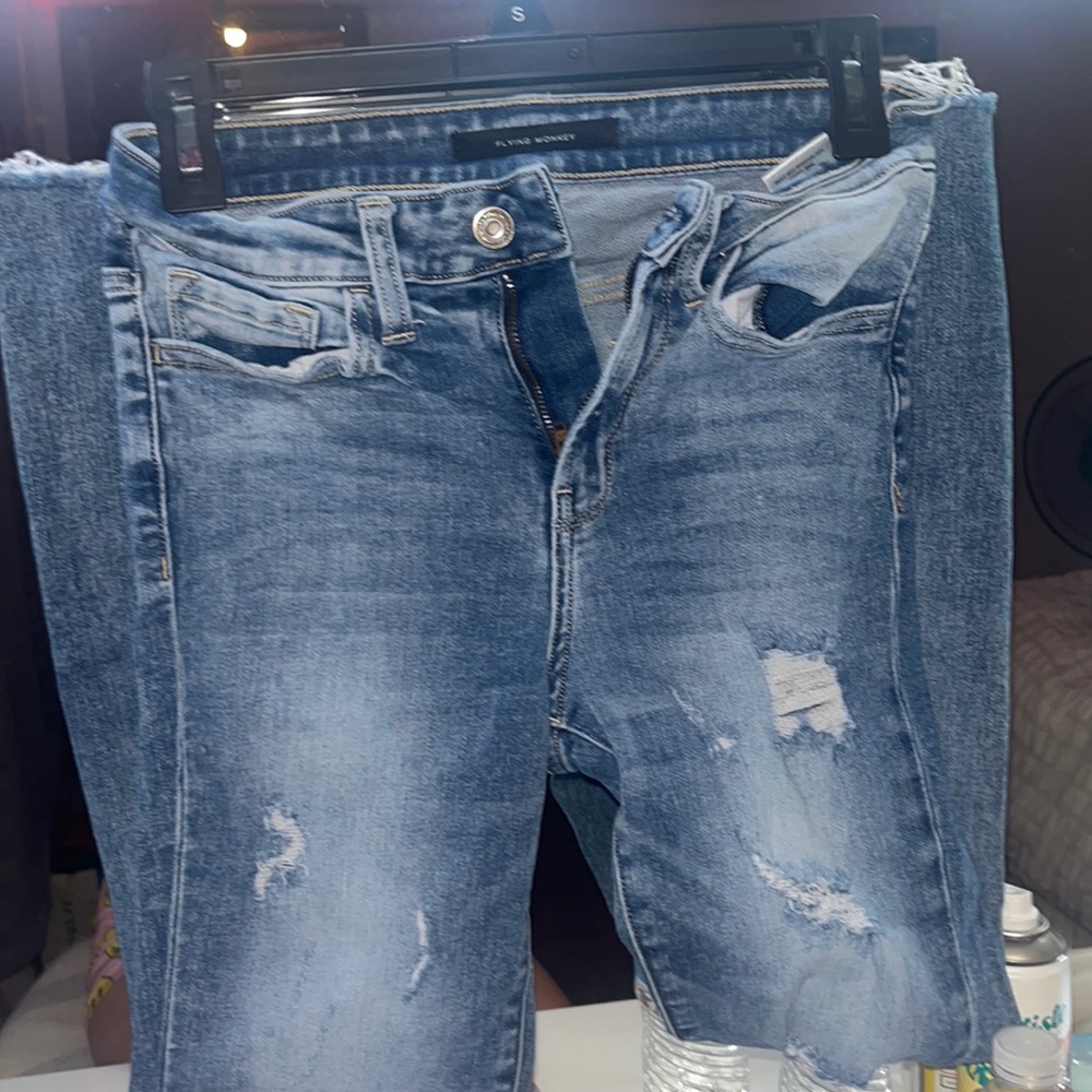 Buckle ripped jeans